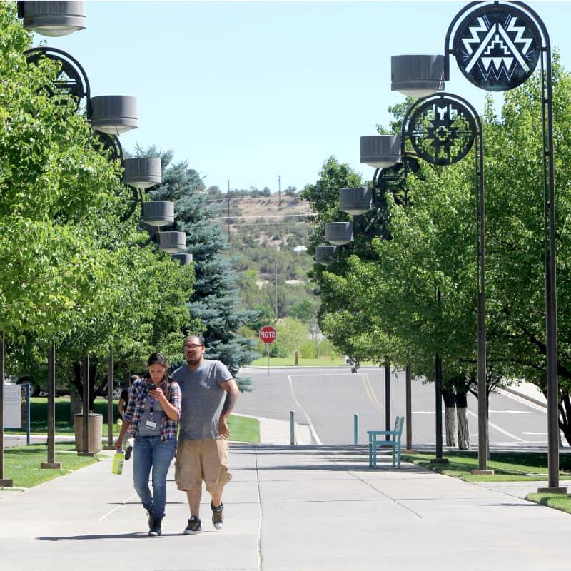 Couple walking up sidewalk to SJC